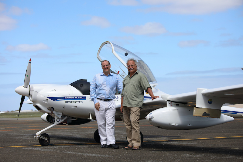 Simon Hackett (left) with Jorg Hacker and an ARA plane